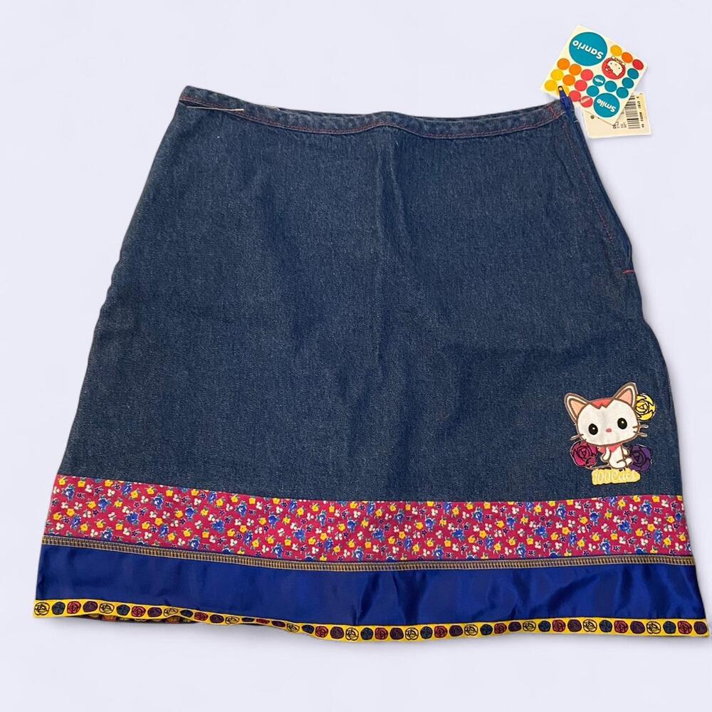 Nwt Hello Kitty denim skirt. Measurements 13" by 16 inch small women 13/14 girls